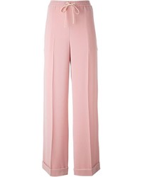 Розовые широкие брюки