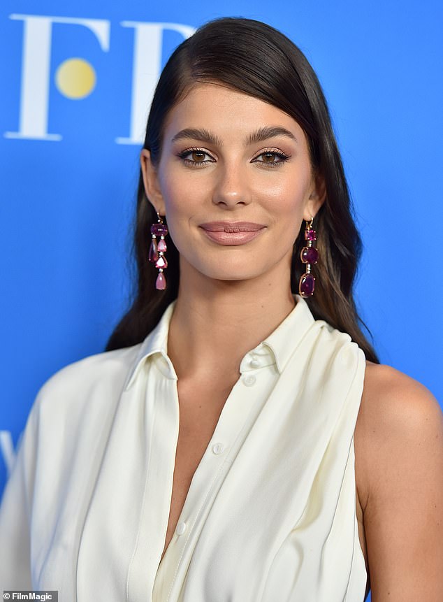 Razzle dazzle: The brown eyes beauty wore long pink earrings that added elegance