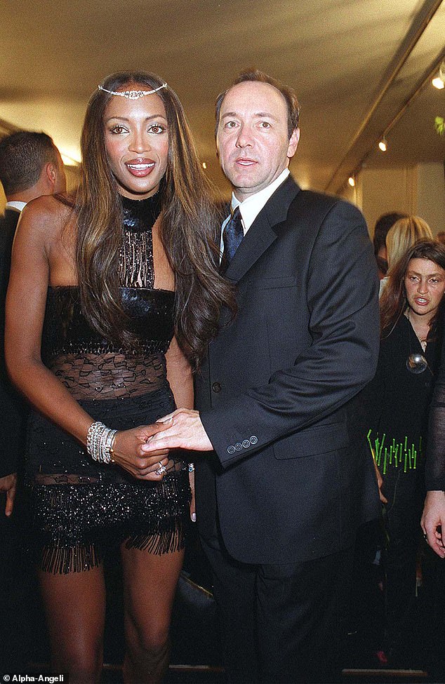 Disgraced superstar Kevin Spacey with Naomi Campbell at the Versace fashion show in Paris, 2001. He has been accused of making inappropriate advances towards men