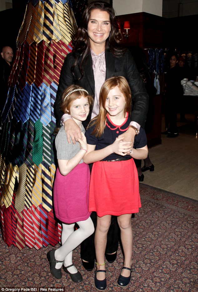 Doting mum: Brooke shields poses with her daughters Rowan and Grier