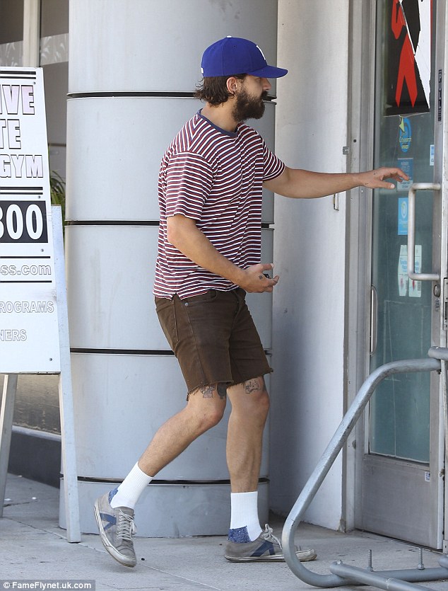 Relaxed: The Eagle Eye star took a break from filming road-movie American Honey to step out in somewhat non-traditional work-out gear - in a baggy striped t-shirt, and white socks with battered white low-top sneakers