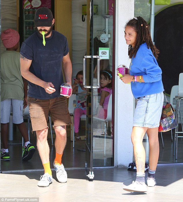 Chill: On August 10 he was spotted with a pretty young woman when getting frozen yogurt at Menchie