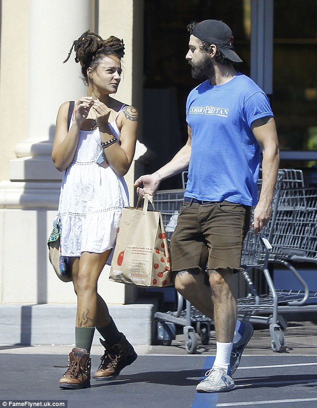 There she is again: Shia LaBeouf was spotted with a mystery woman while picking up groceries in Sherman Oaks, California on Sunday